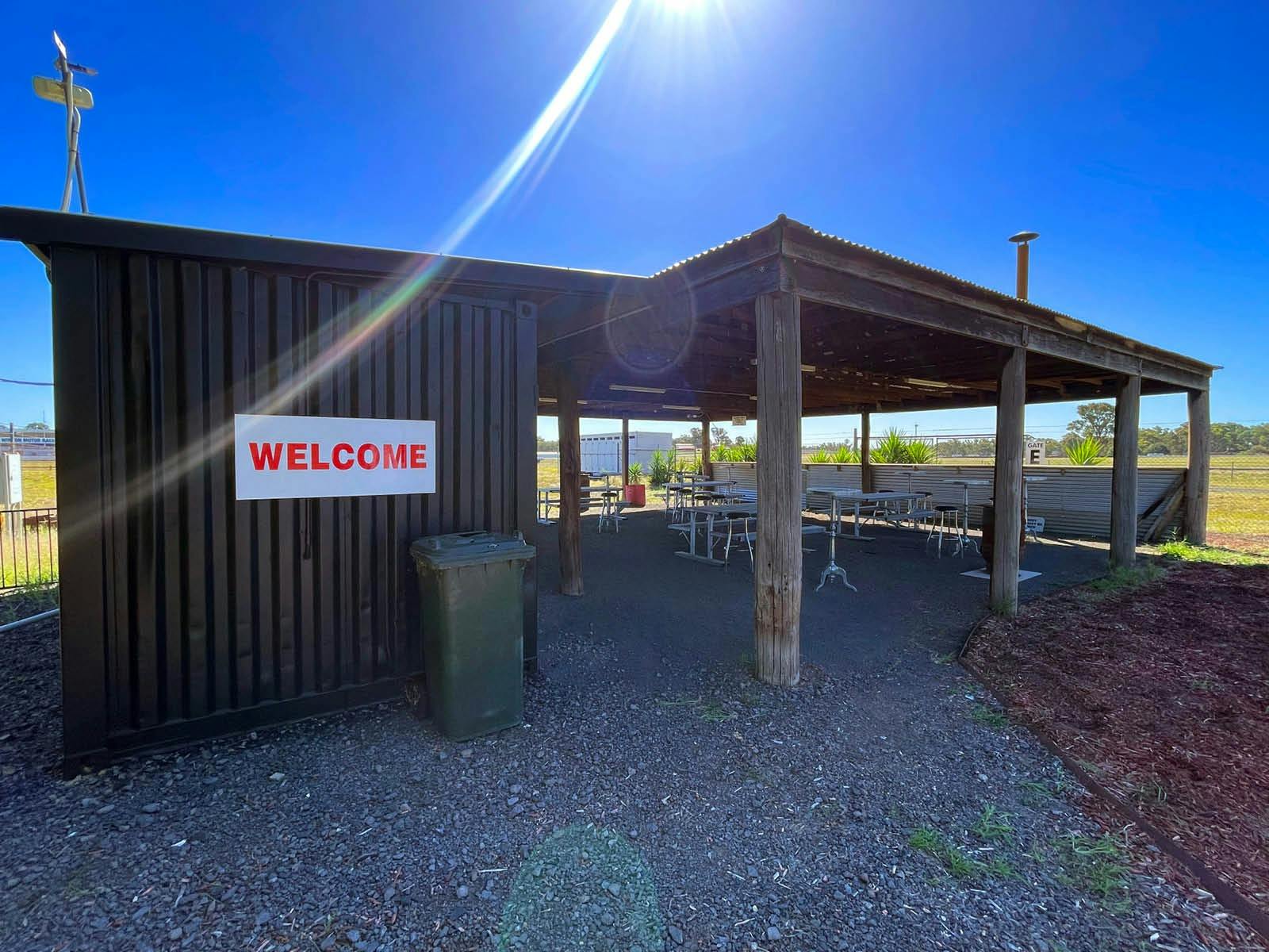Photo of campground covered area with seating and tables