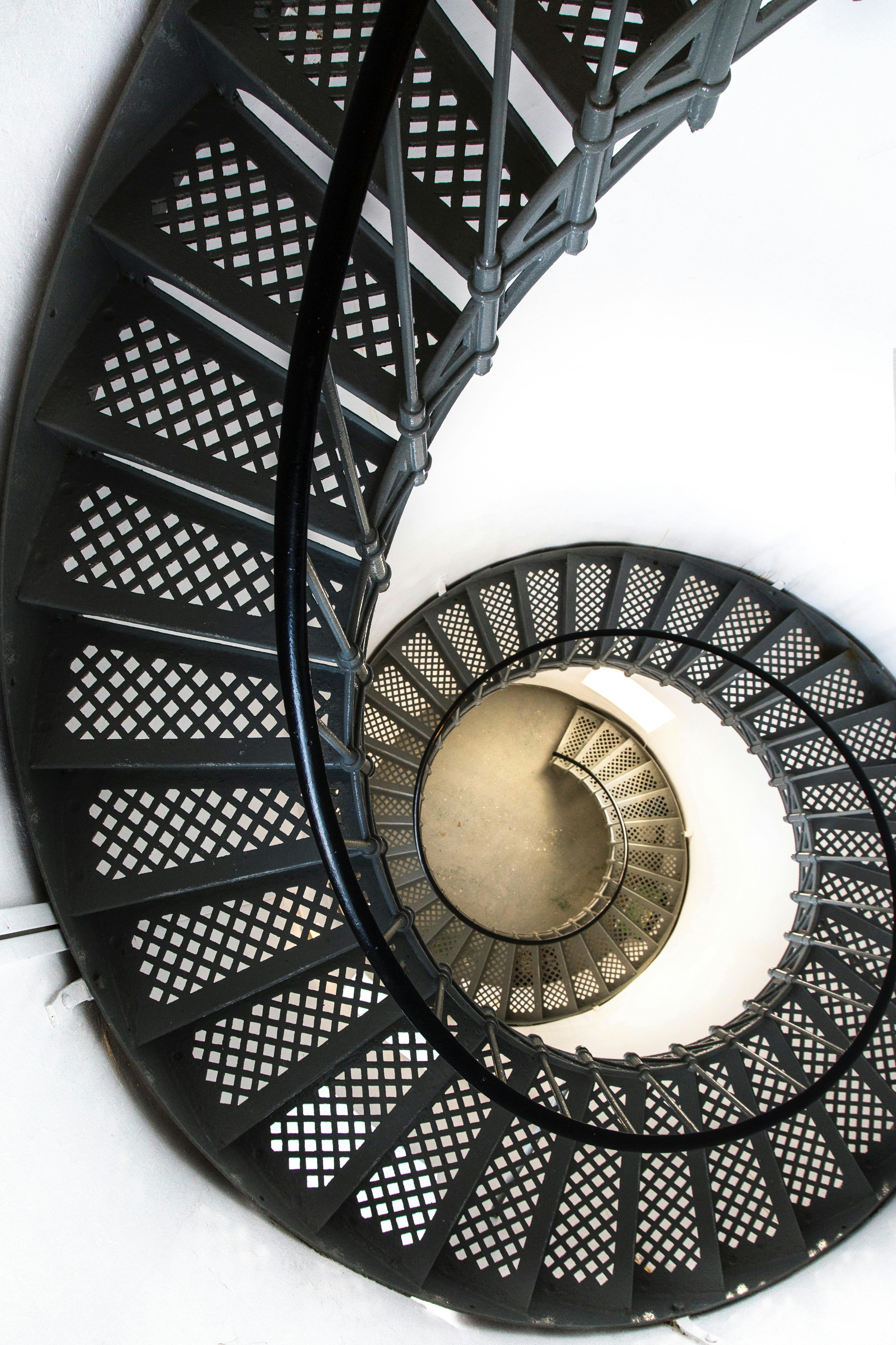 Climb the iron spiral staircase to the top of the lighthouse