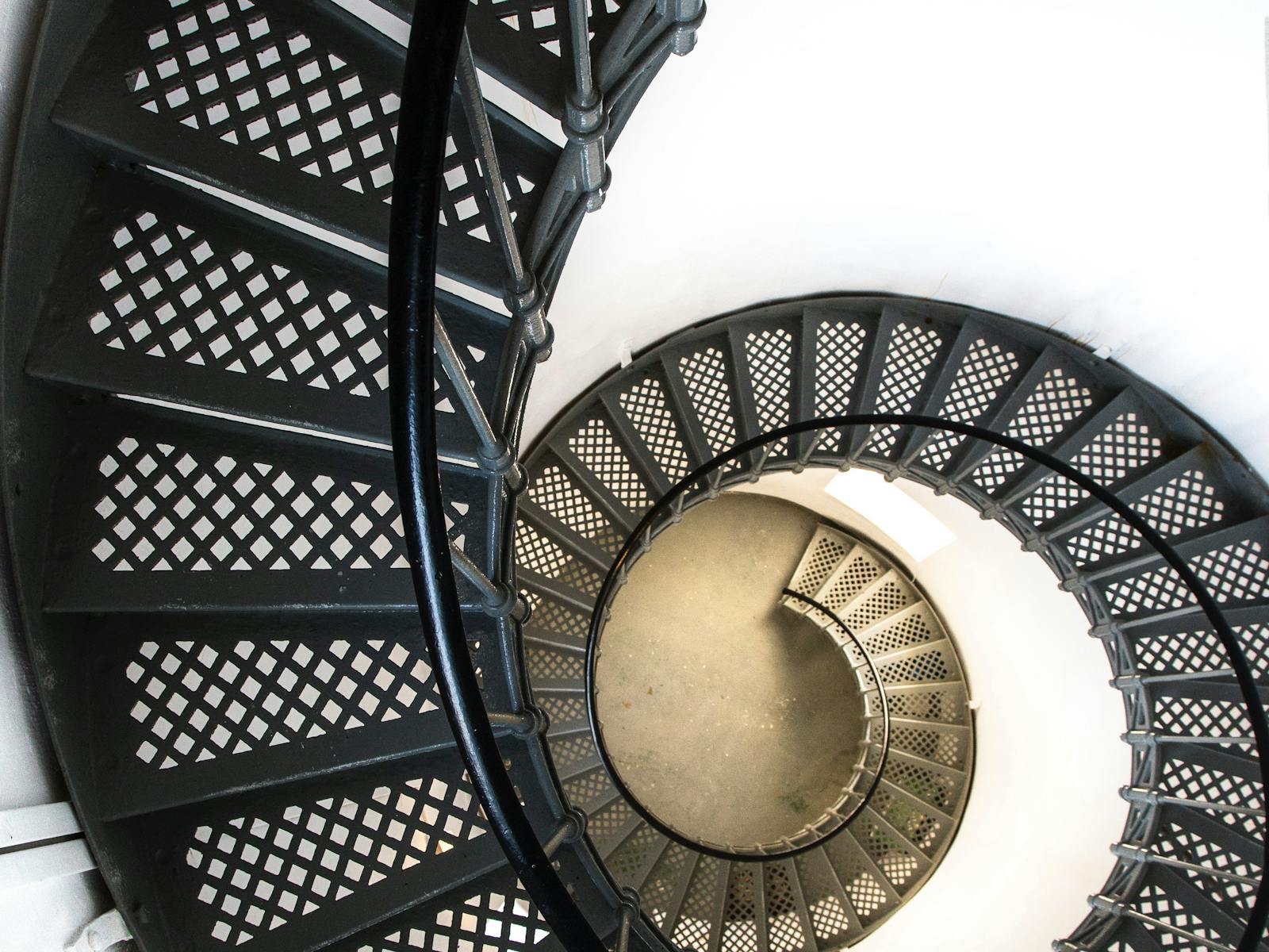 Climb the iron spiral staircase to the top of the lighthouse