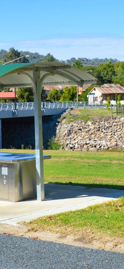 Barbeque area at Caravan park entrance, looking over creek towards the Royal Hotel