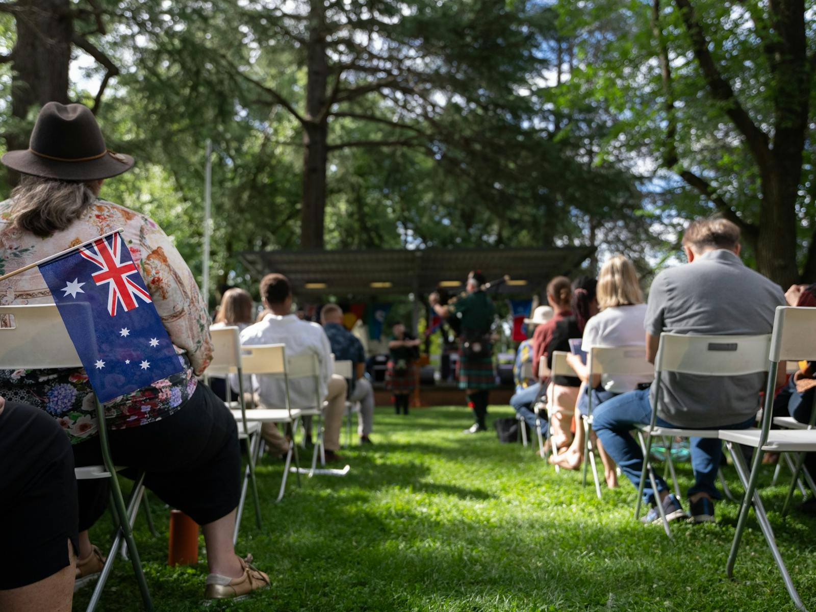 Seating at the park with Australian flag in foreground, 2025
