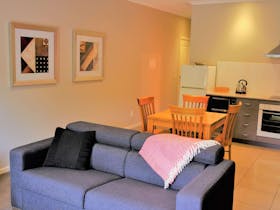 Self contained studio apartment with kitchenette.