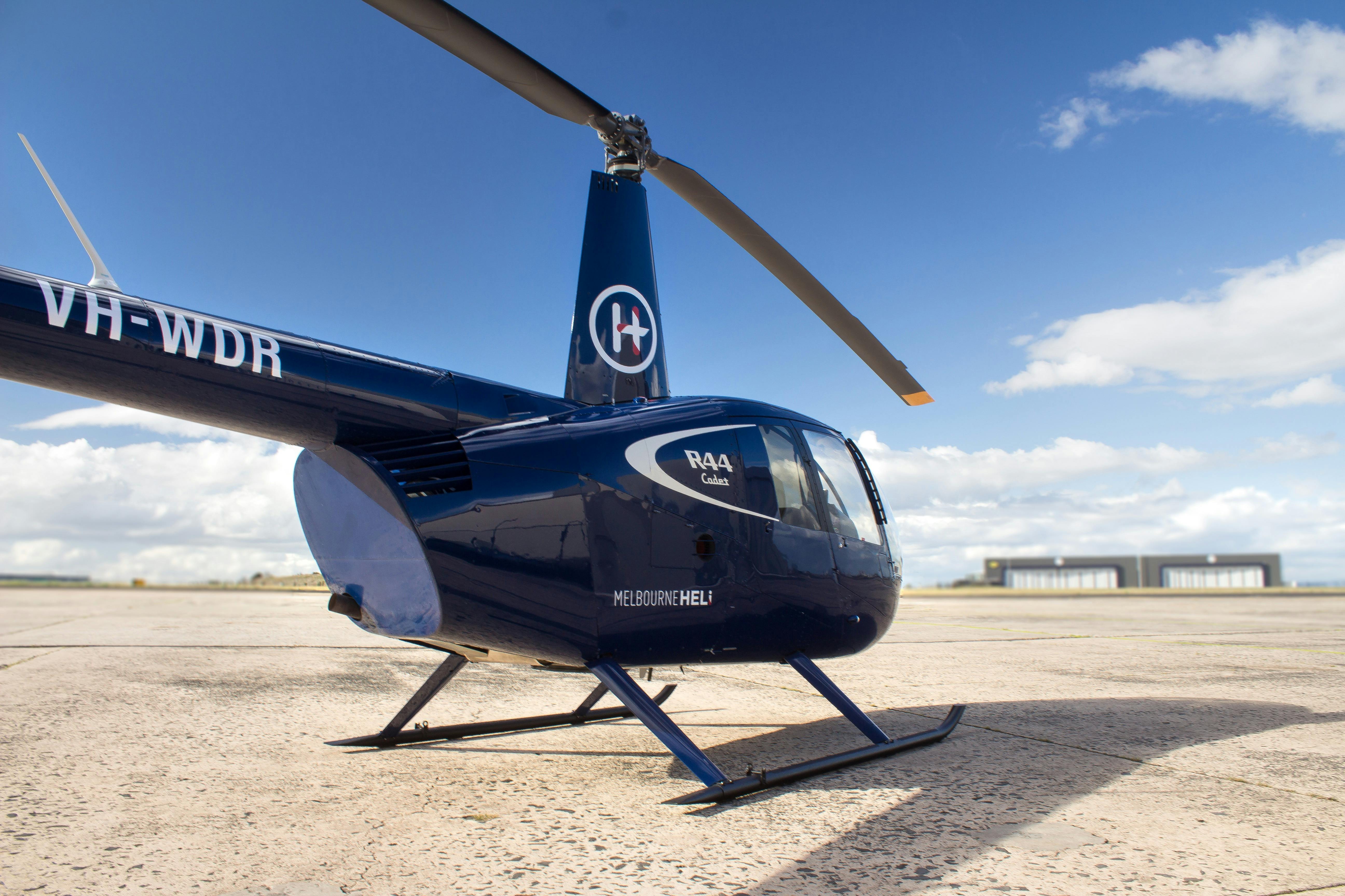 Blue helicopter parked at the airport