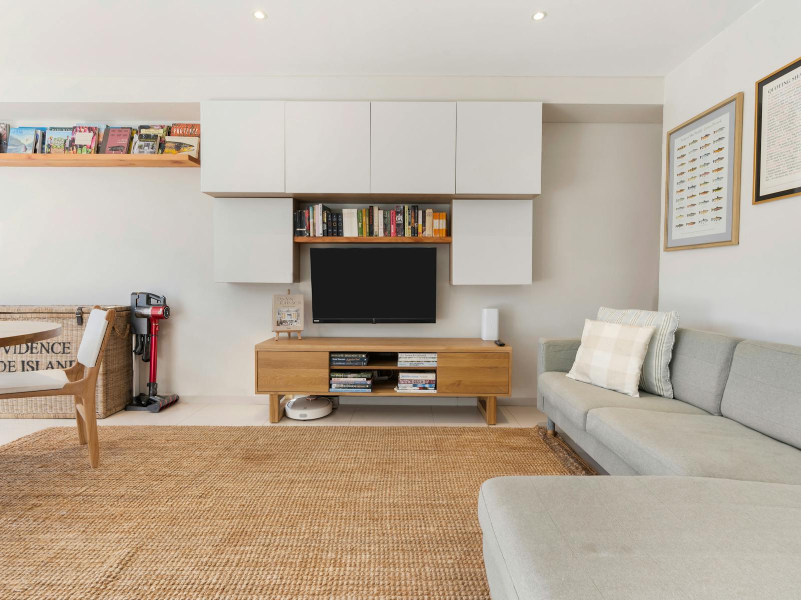Modern kitchen and living space with a turquoise splashback and a cozy private courtyard.