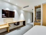 Modern guest room with desk at Quality Hotel Rules Club