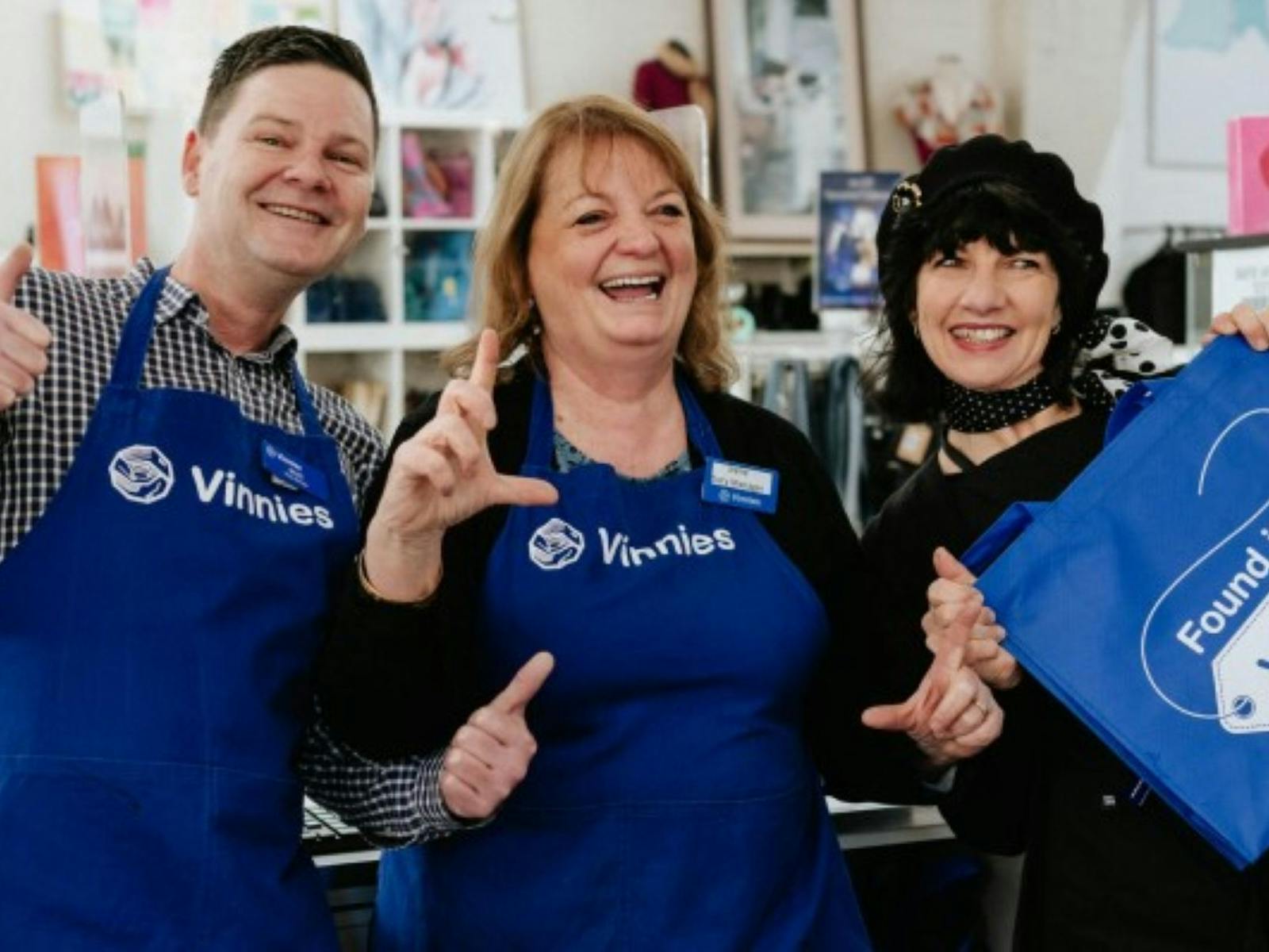 Three Vinnies volunteers smiling