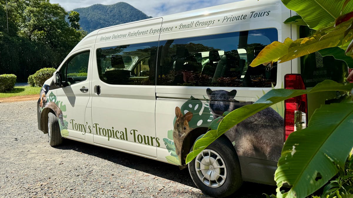 Tony's Tropical Tours' van in front of Thornton's Peak