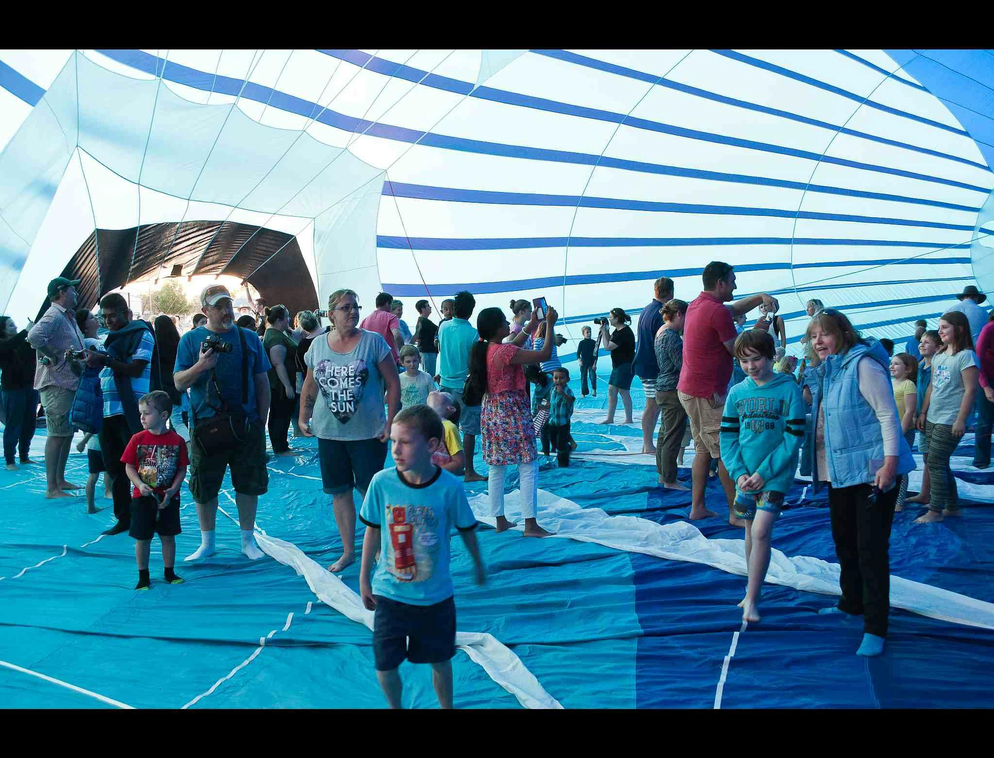 Happy festival people walking in a balloon