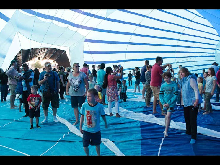 Happy festival people walking in a balloon