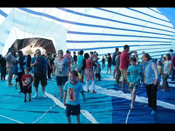 Happy festival people walking in a balloon