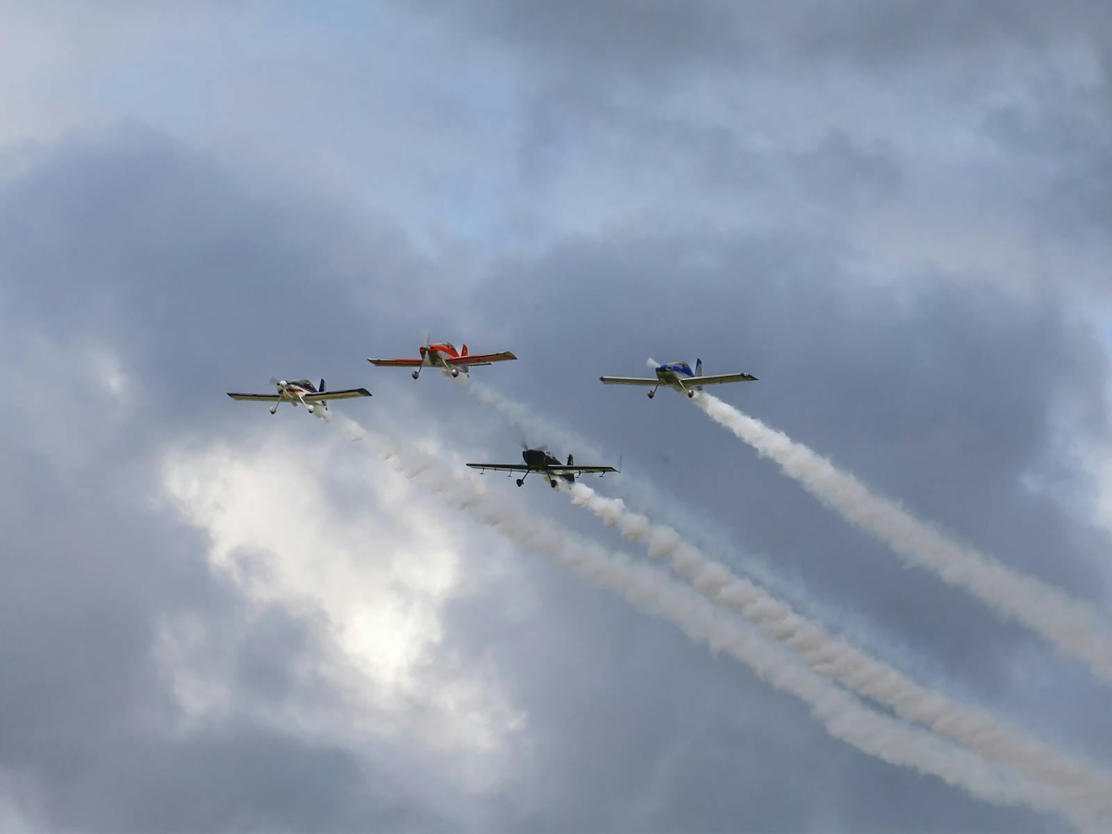 The silver sharks aerobatic team flying over The Bend at the OTR SuperSprint