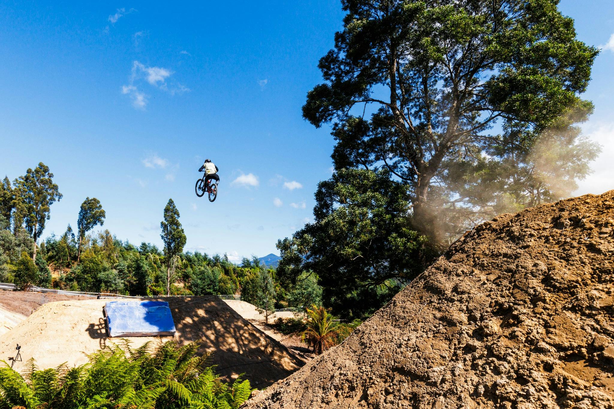 Rider jumping between doubles at MTB event