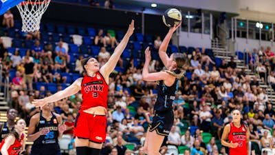 UC Capitals player shooting the basketball while a defender closes in.