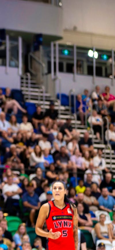 UC Capitals player shooting the basketball while a defender closes in.
