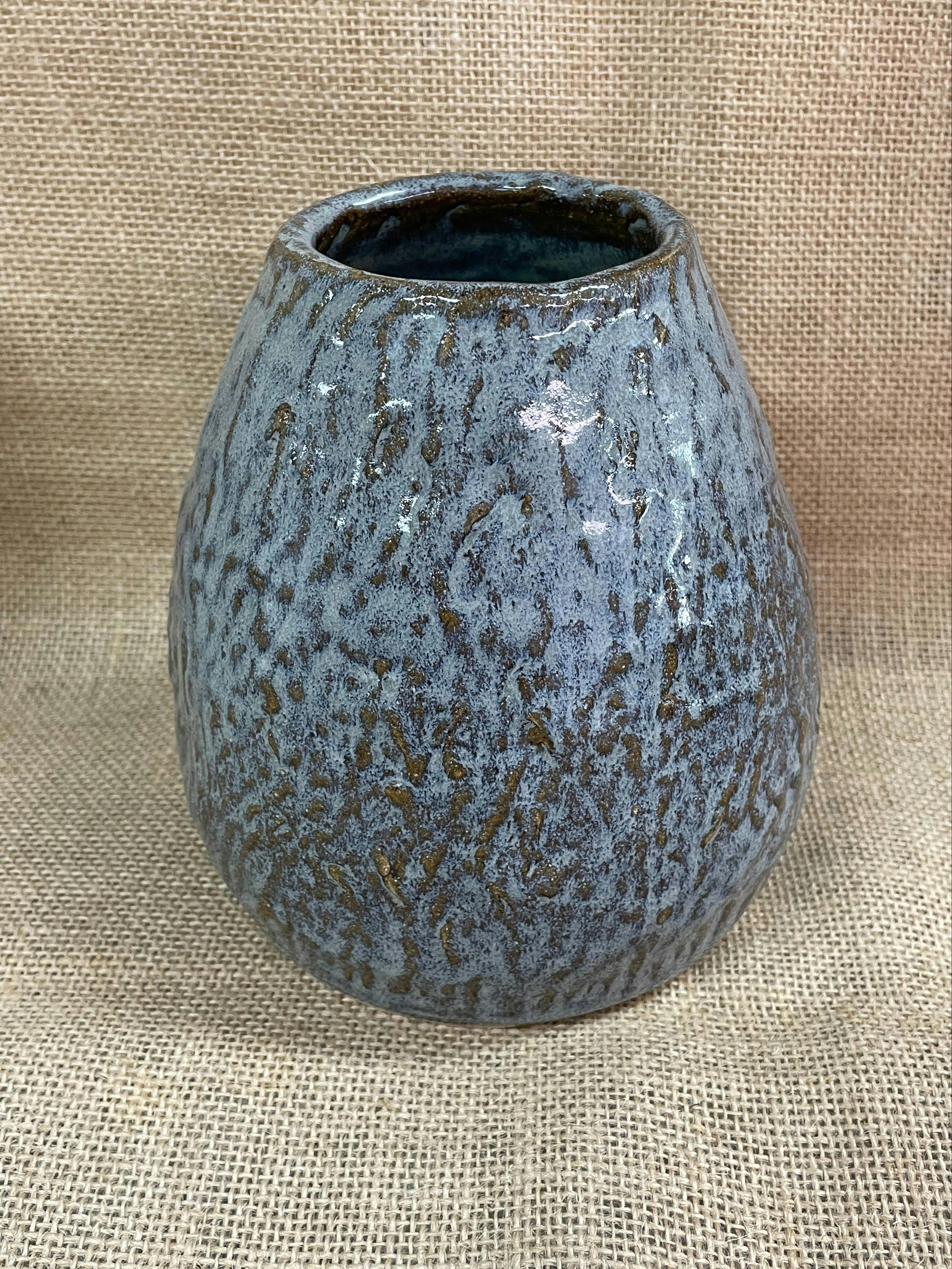 image of a blue handbuilt pottery vase