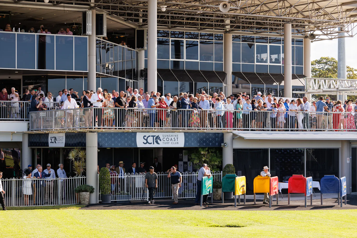 Large crowd of member on the members terrace watching the races