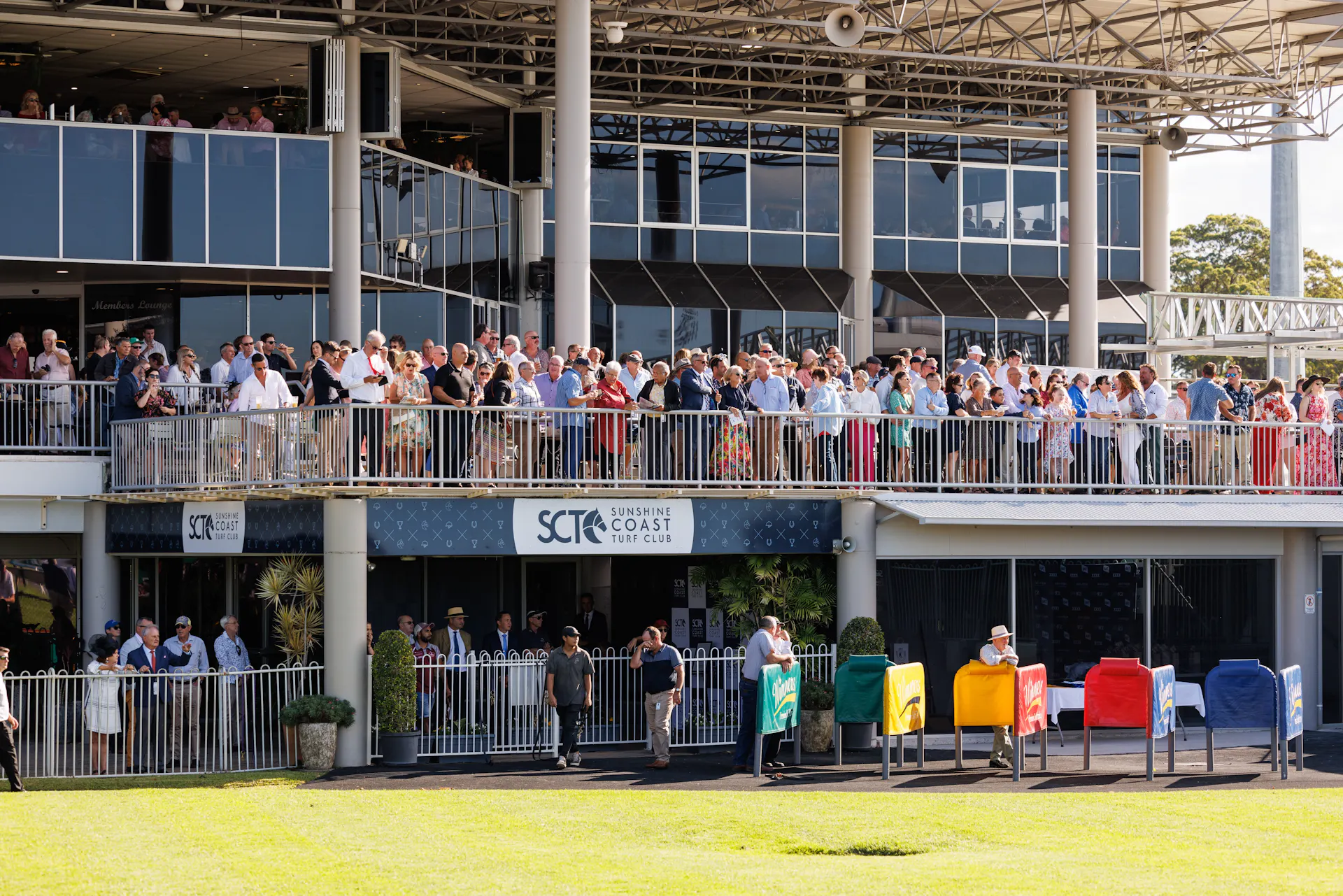 Large crowd of member on the members terrace watching the races