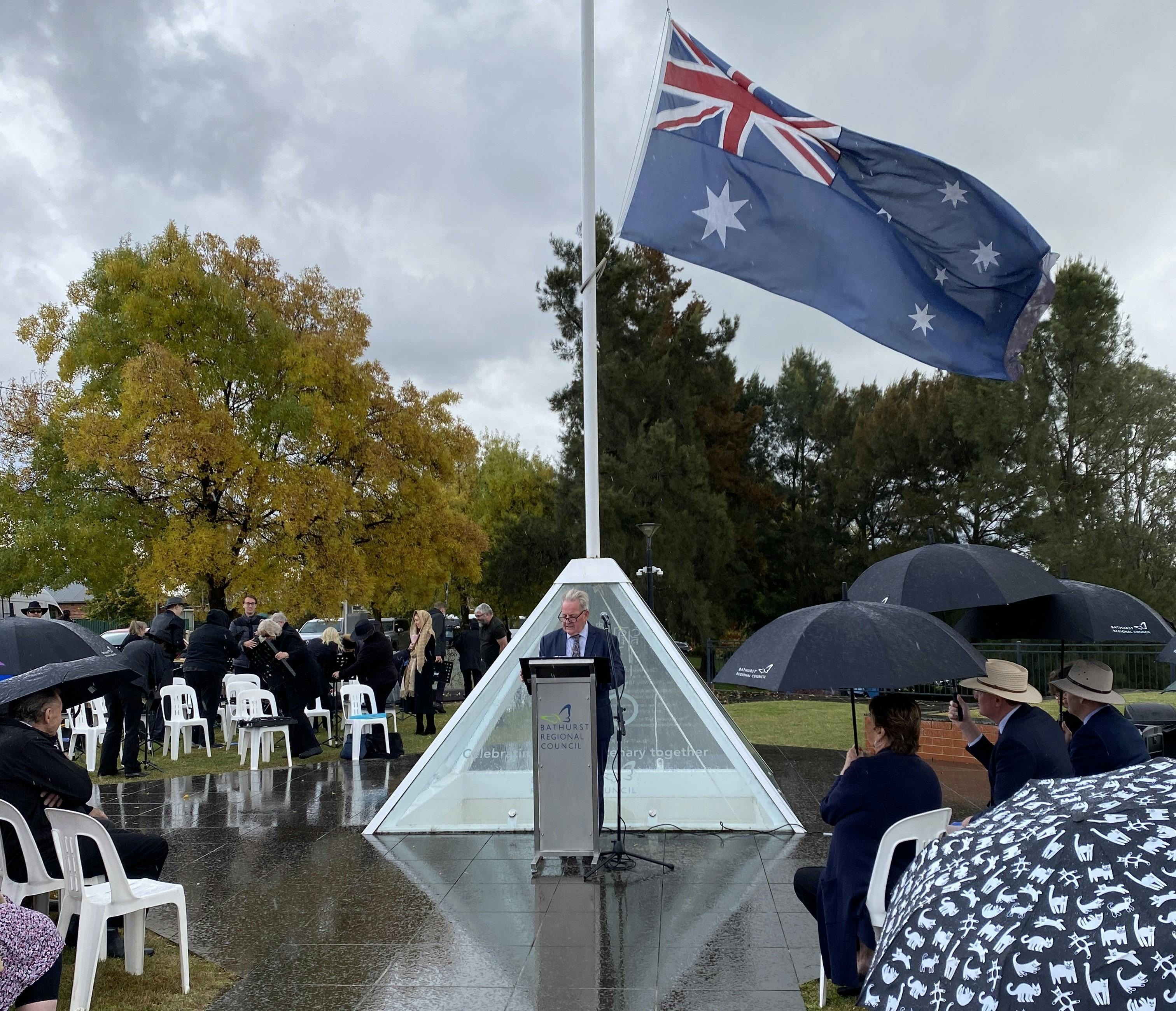A group gathers by the Bathurst Flagstaff for Proclamation Day