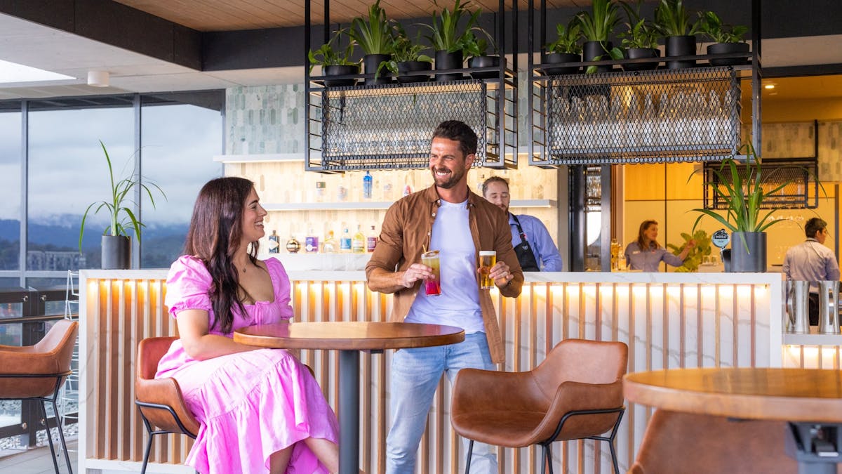 Couple enjoying drinks at the bar area