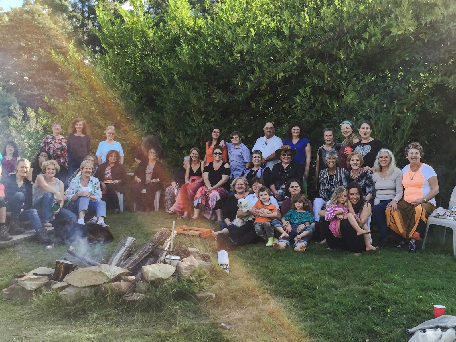 Group photo around campfire