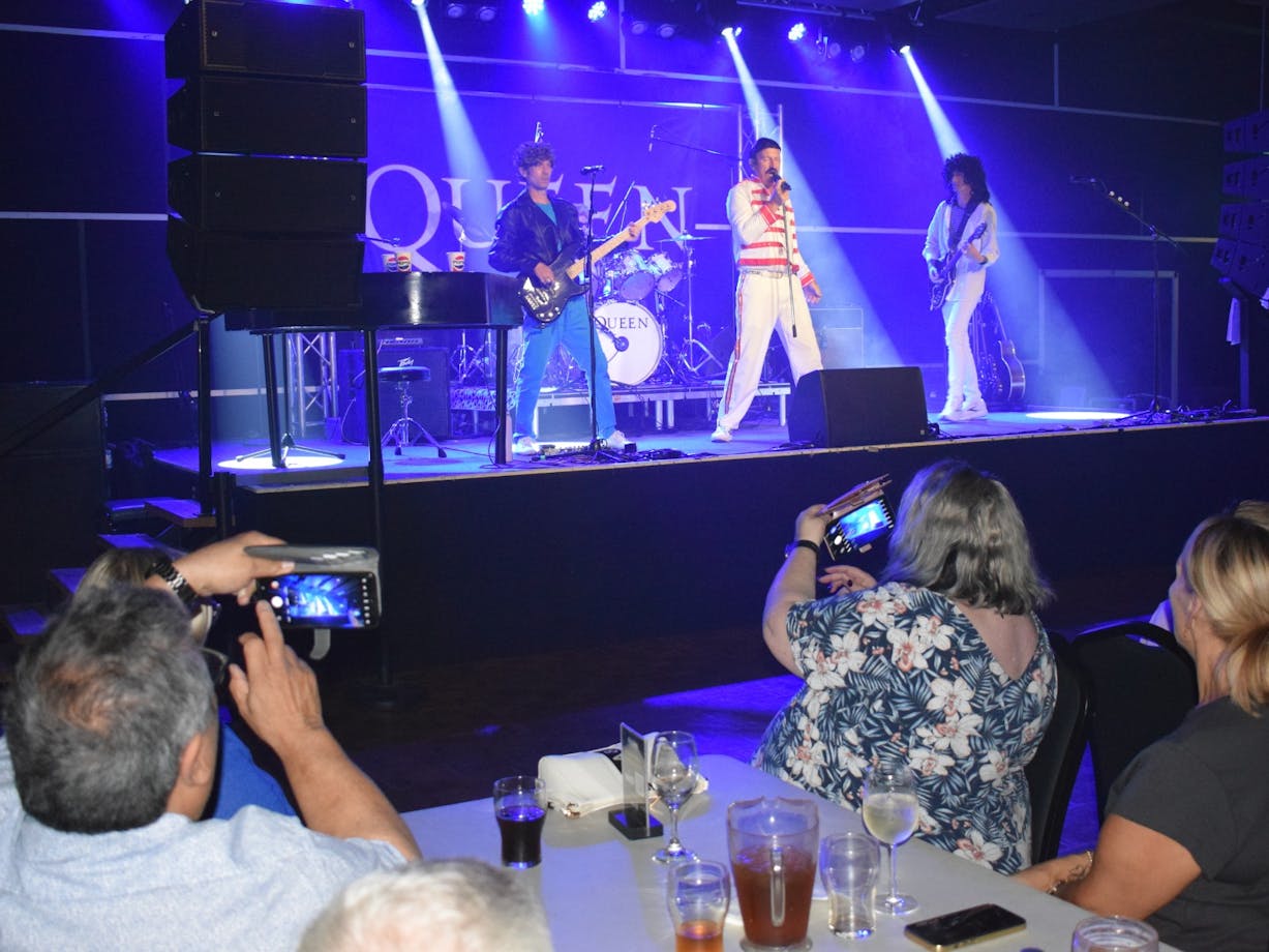 Audience watching Queen the Show at the Harmonie German Club in 2025