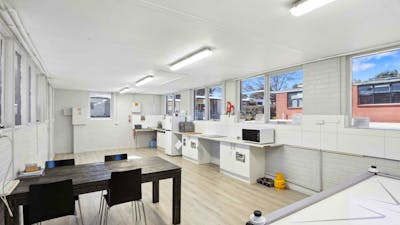 Spacious guest rec room with dining, cooking facilities & air hockey for guests to enjoy