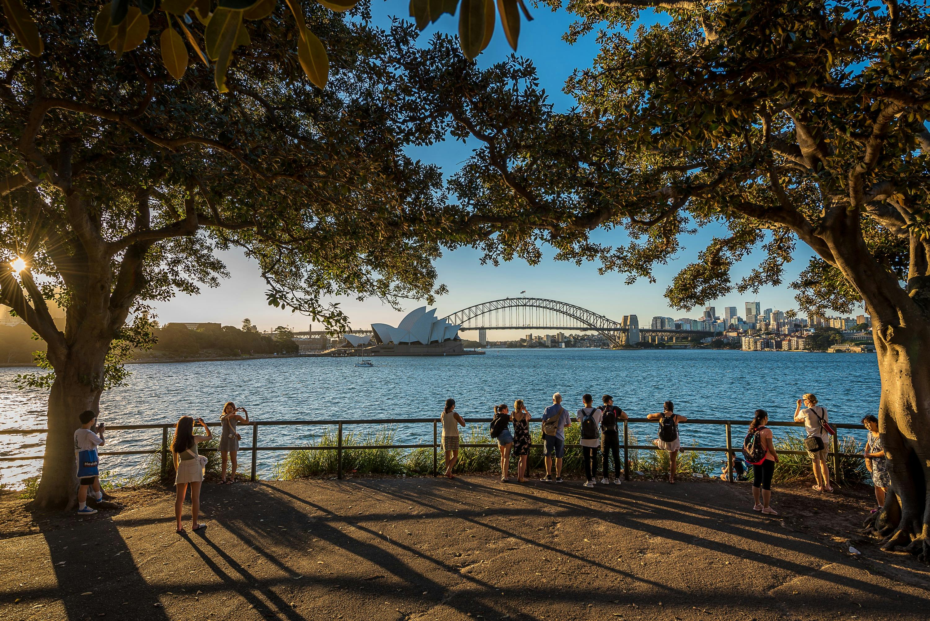 late afternoon sunlight at platform to view the Opera House and Harbour Bridge