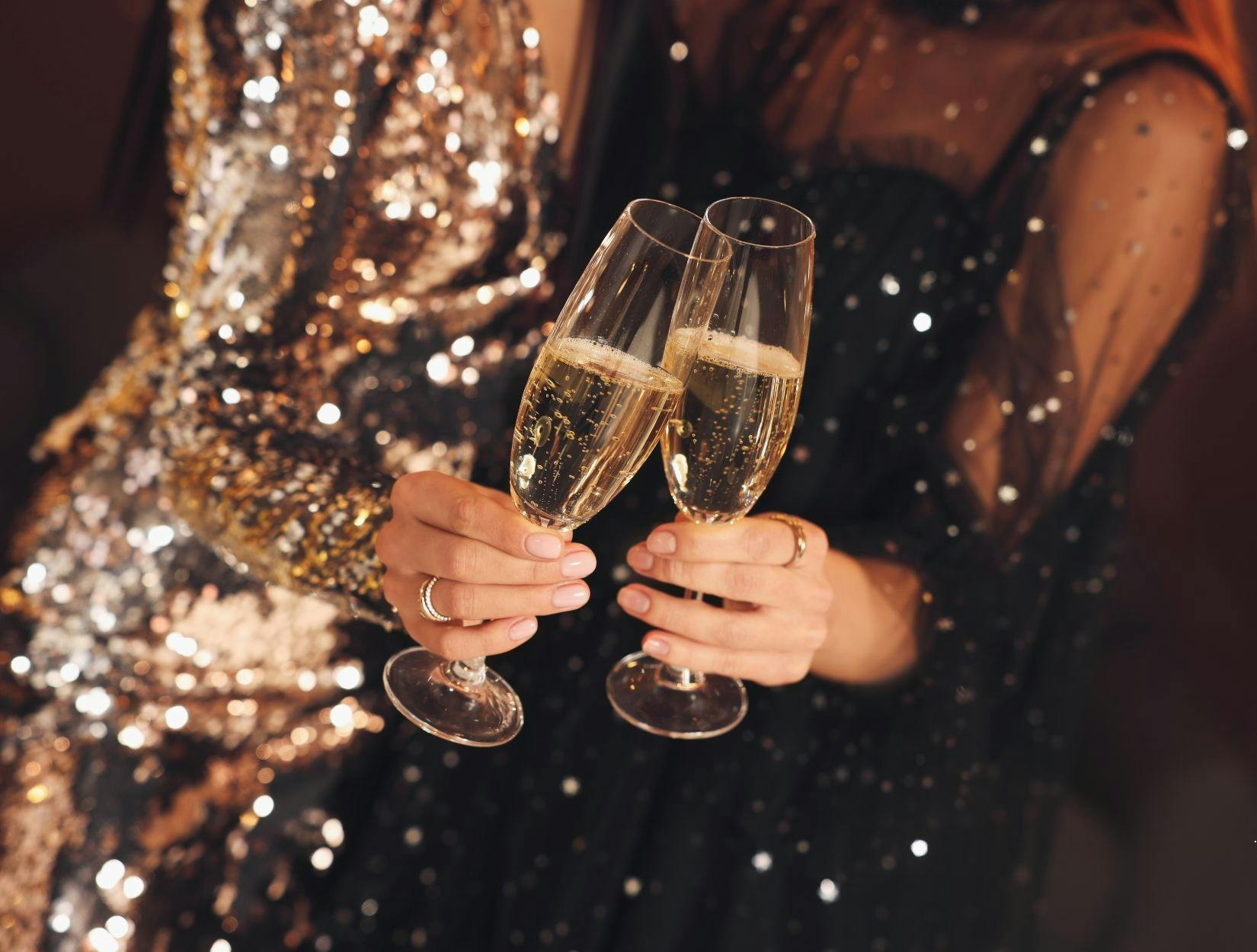 two women with glasses of champagne