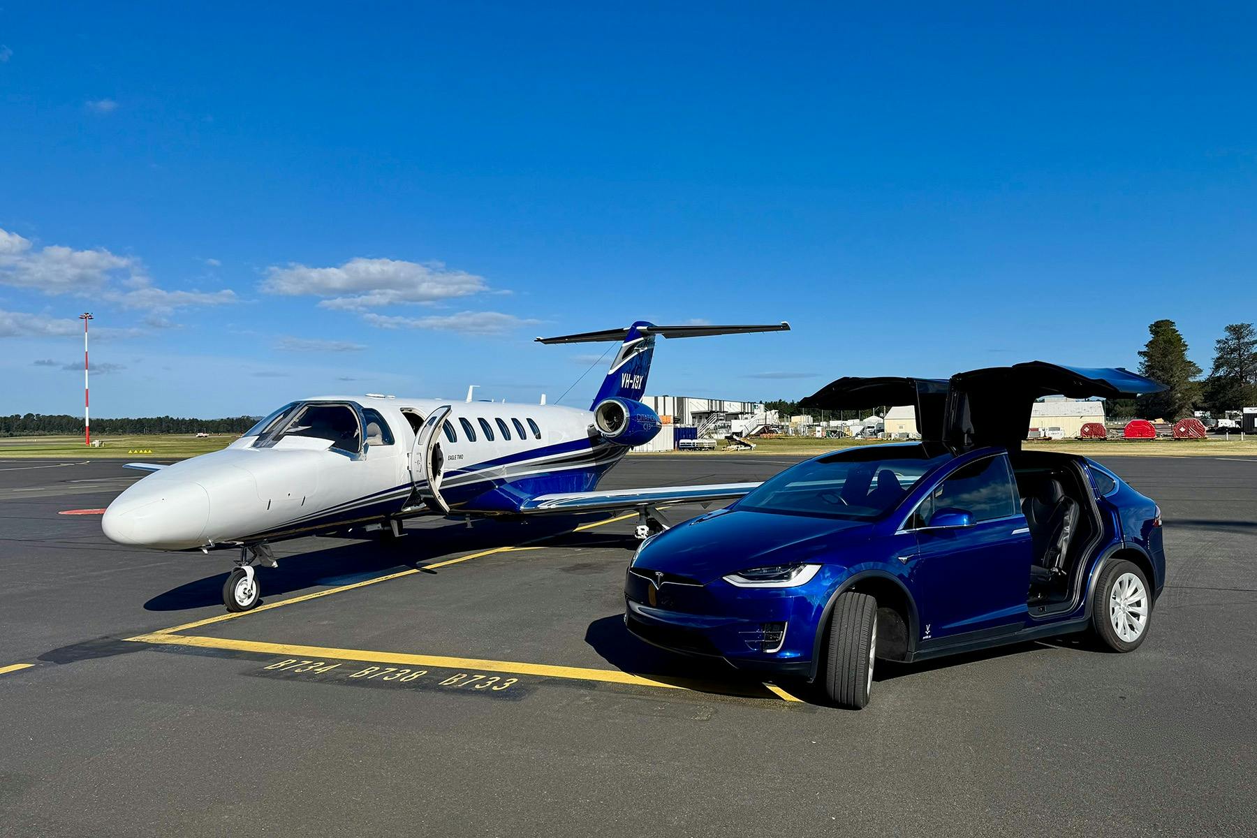 EVRide on tarmac with private jet