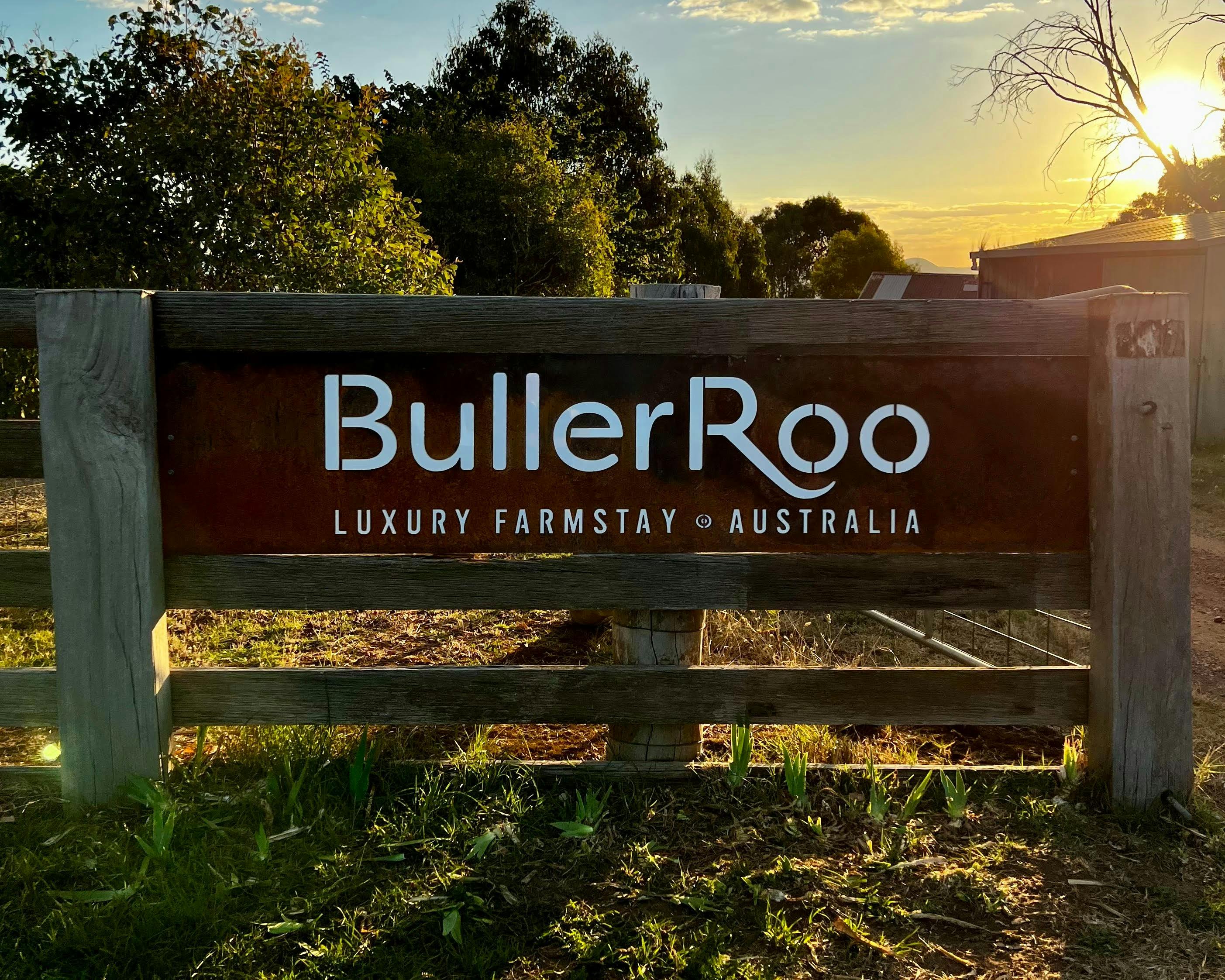 BullerRoo Luxury Farmstay Australia sign with magnificent sunset behind