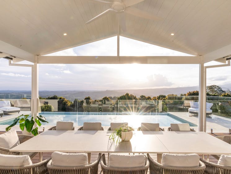 Miren Estate - Byron Bay - Outdoor Dining with Pool and Hinterland Views at Sunset