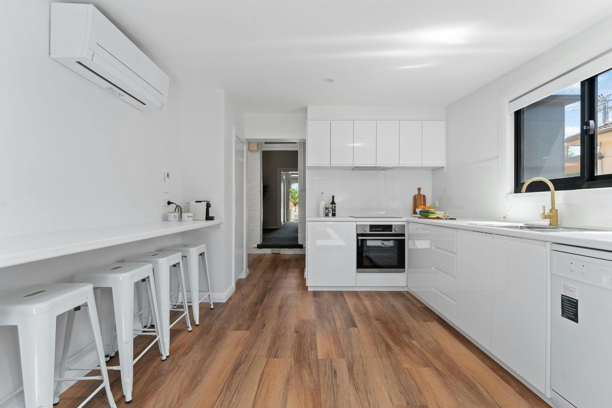 Open kitchen with bench seating and air conditioning