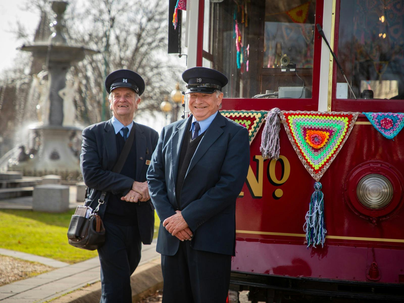Bendigo Tramways Tram Drivers pose and smile in front of Tram