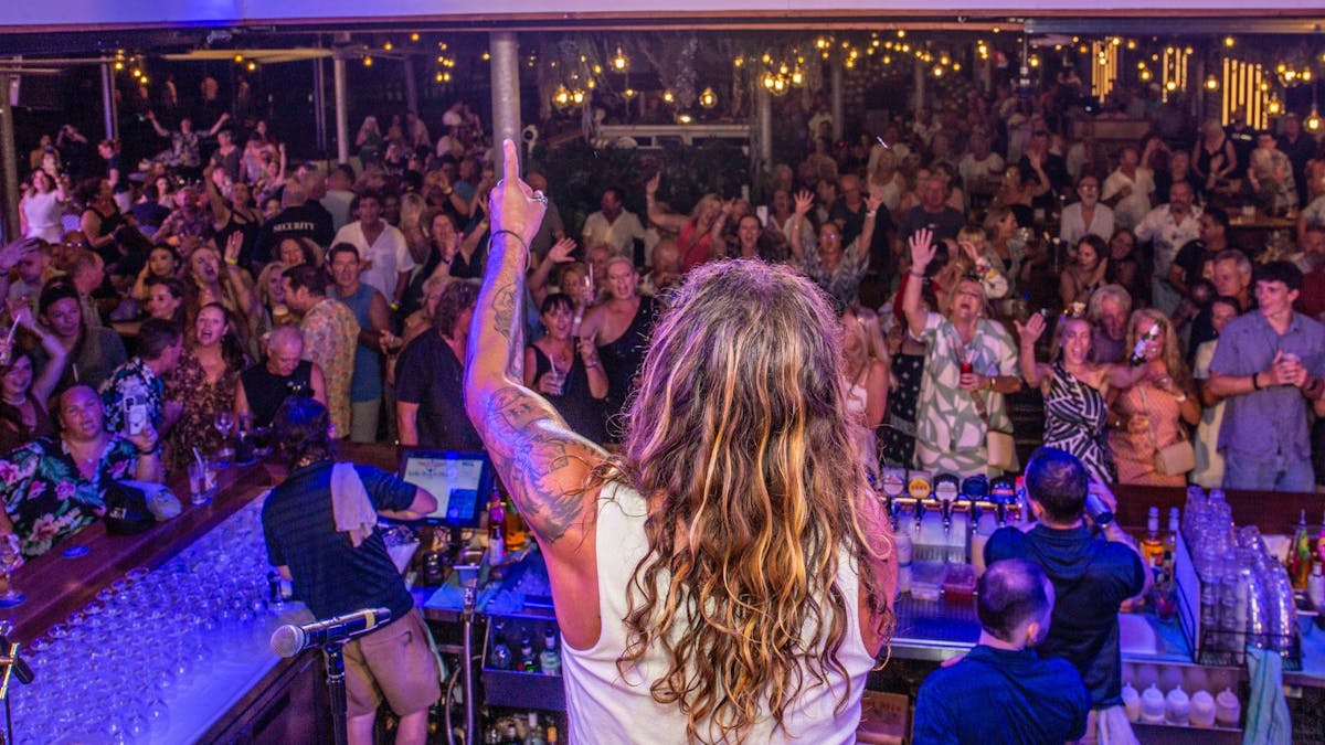 View from behind the band on stage at The Pub Airlie Beach Hotel showing a lively crowd
