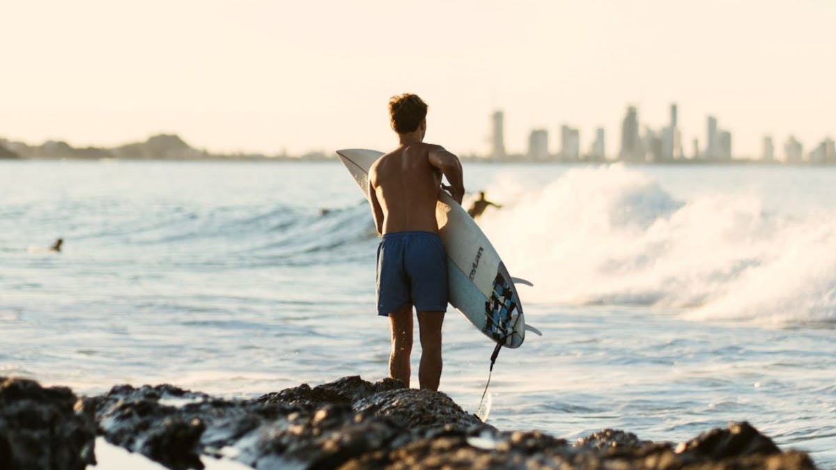 Surfer with Gold Coast Skyline in Background
