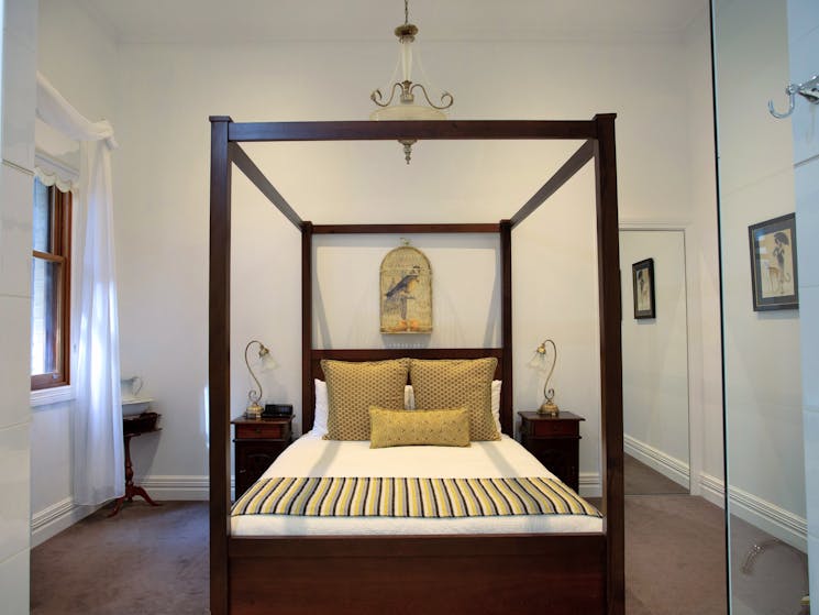 4 poster bed with 12 foot high ceilings. This historical building dates back to 1876