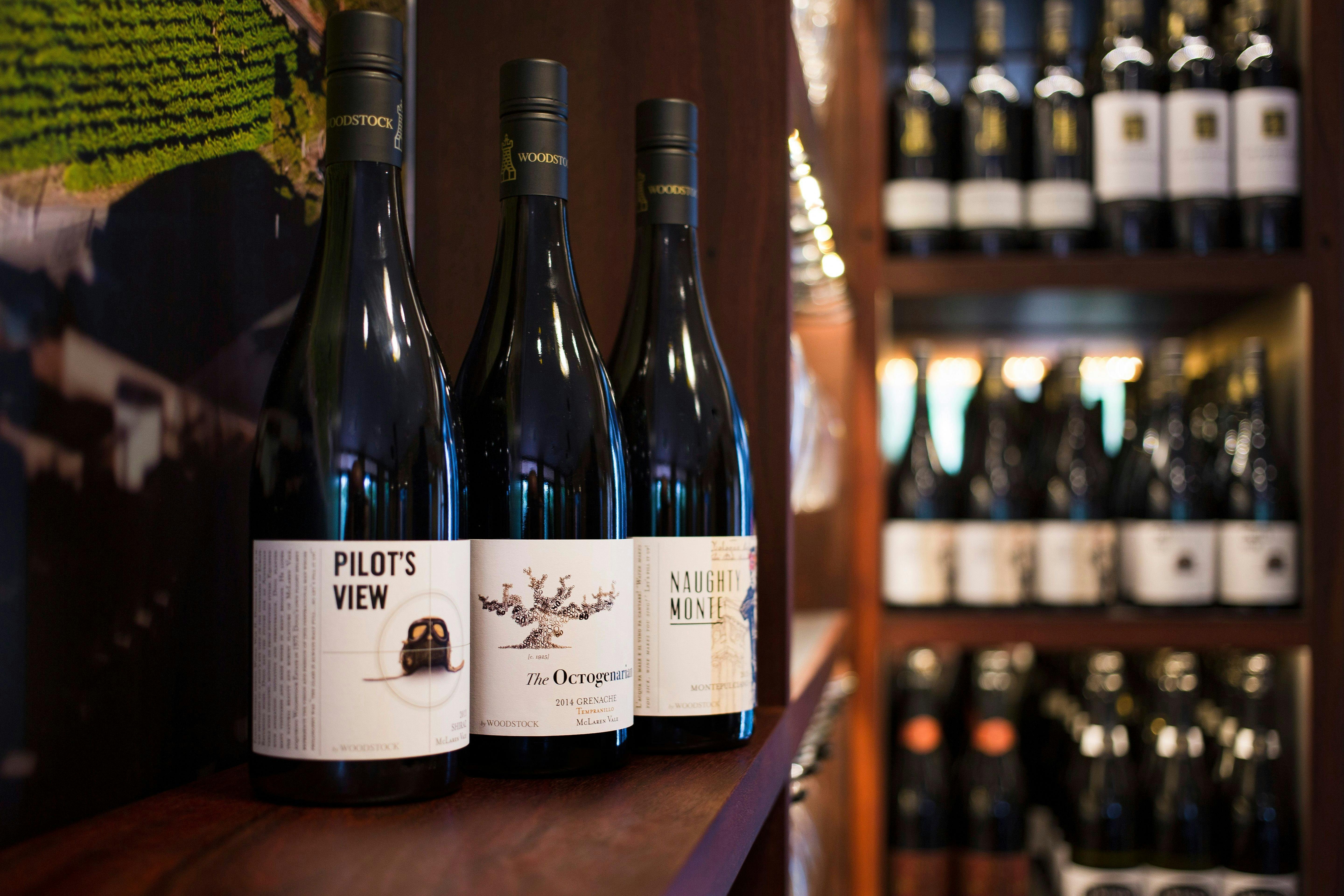 Three bottles of wine in the Woodstock tasting room on the McLaren Vale wine and brew tour