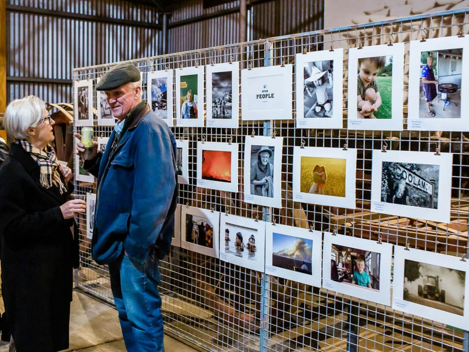A couple observing the Open People category