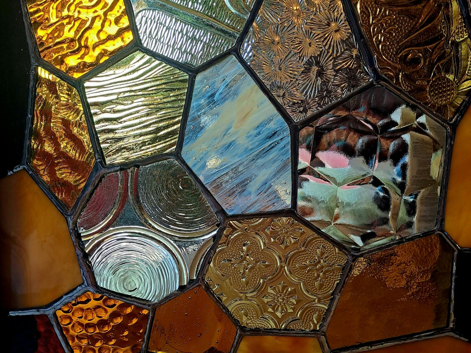 Close up of tiles on a boxed frame lamp
