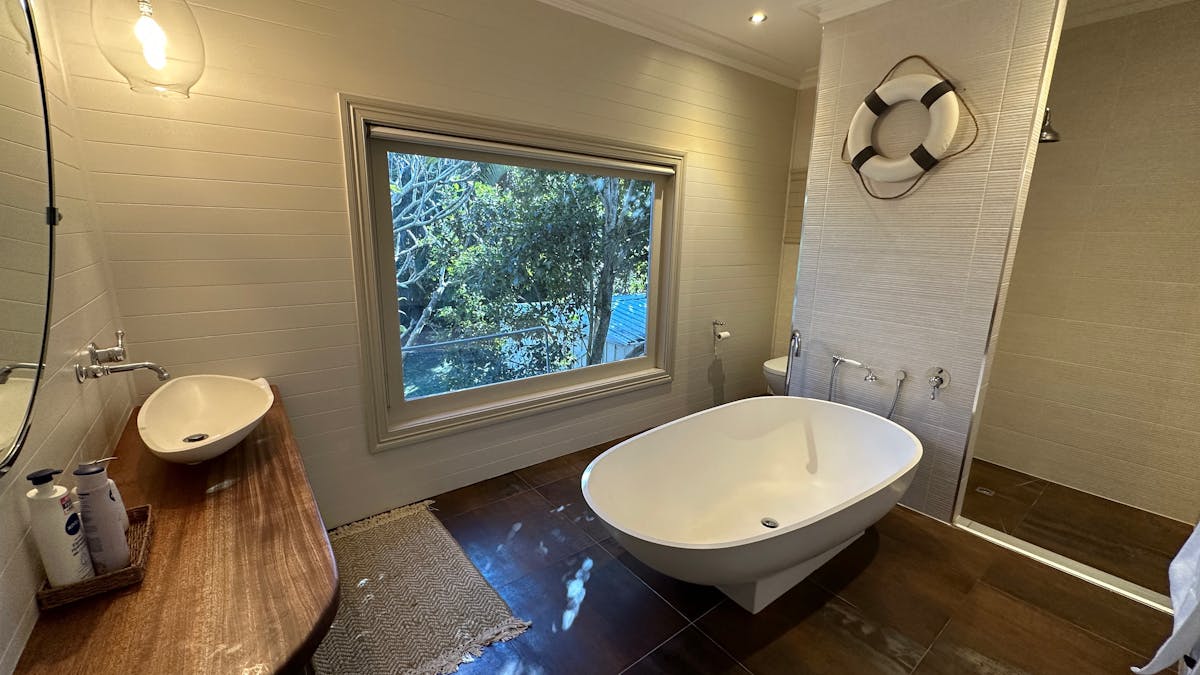 Bathroom with large avocado bathtub, shower and toilet