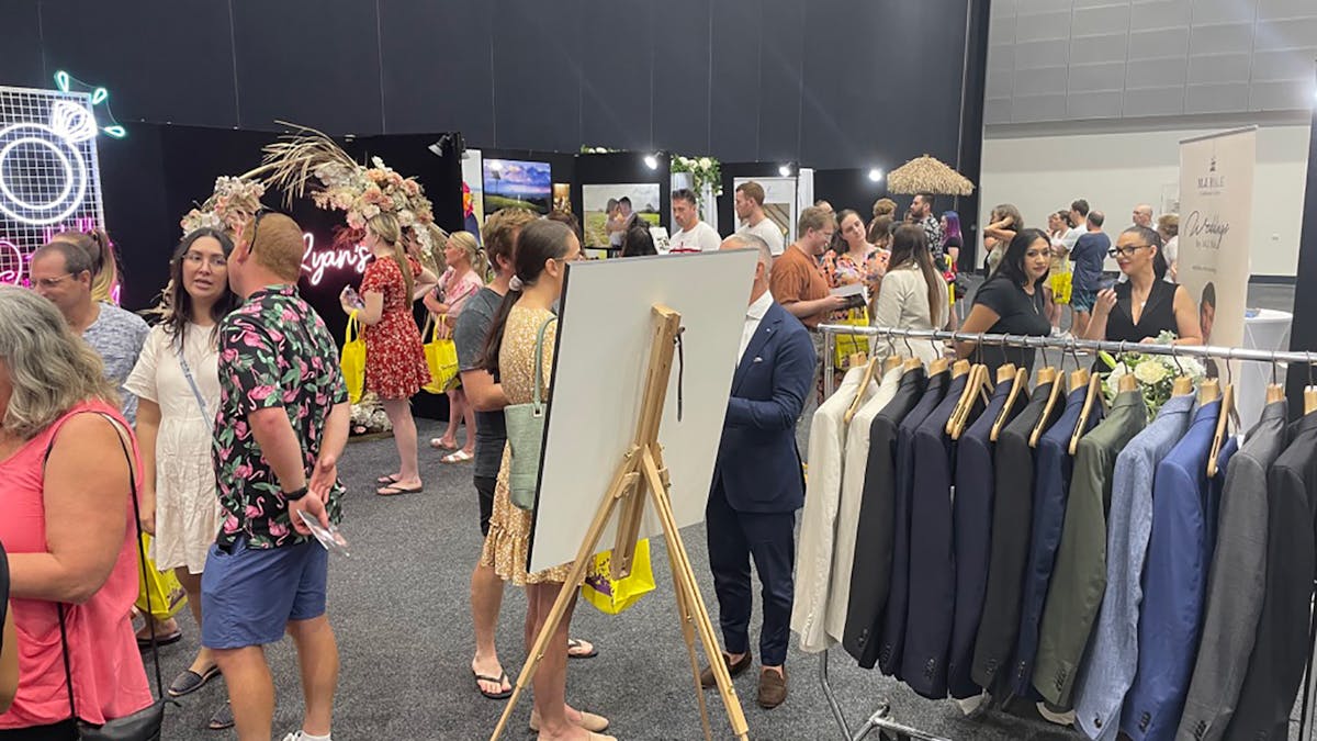 Couples speaking with a variety of exhbitors at Your Local Wedding Guide Gold Coast Expo.
