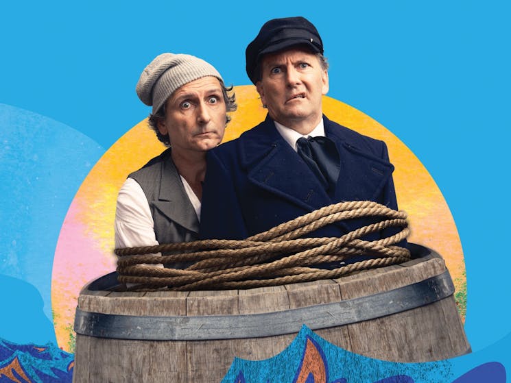 Lano & Woodley in a barrel in front of a blue background.