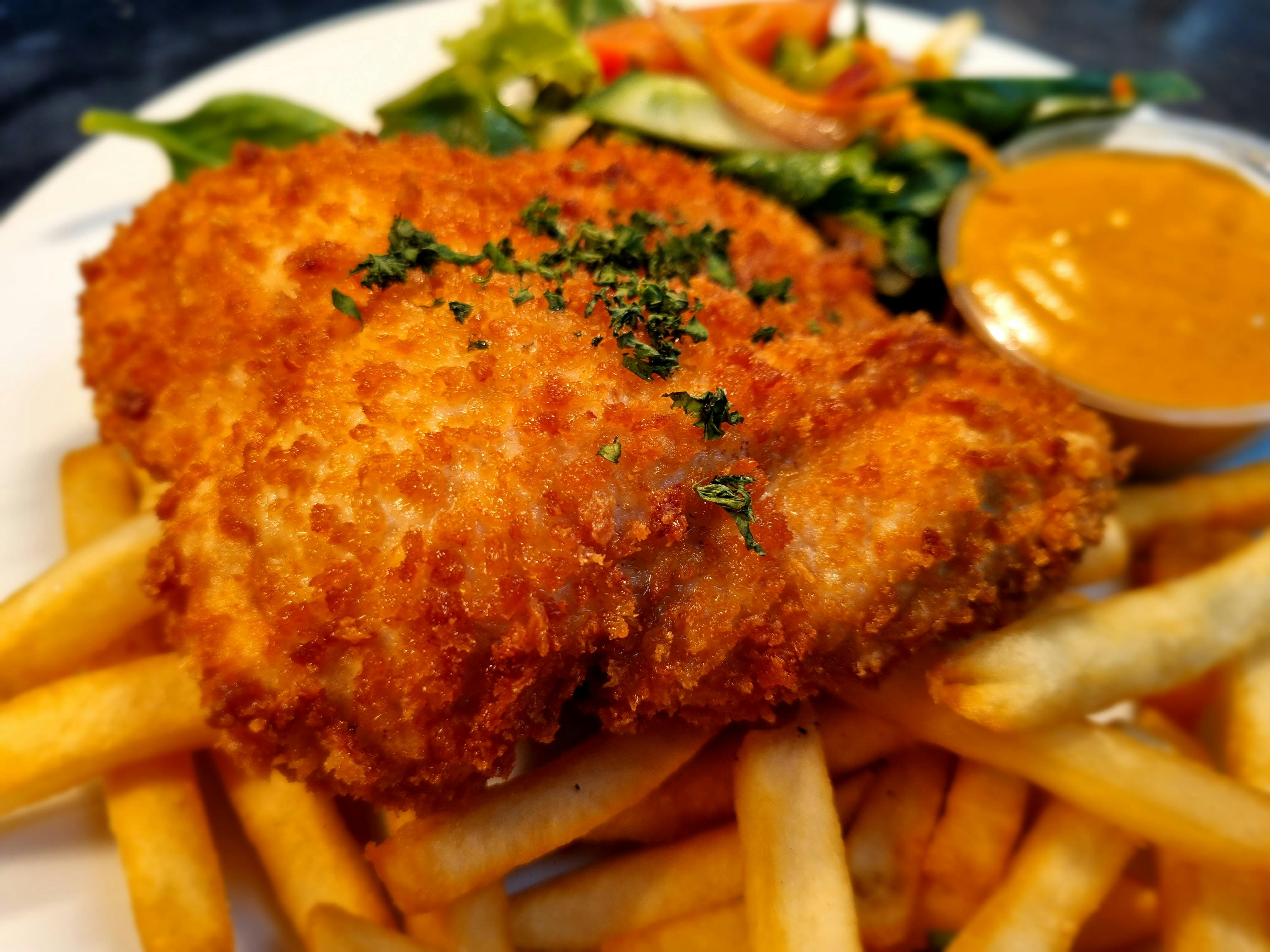 Chicken Schnitzel, with chips, salad and Diane sauce
