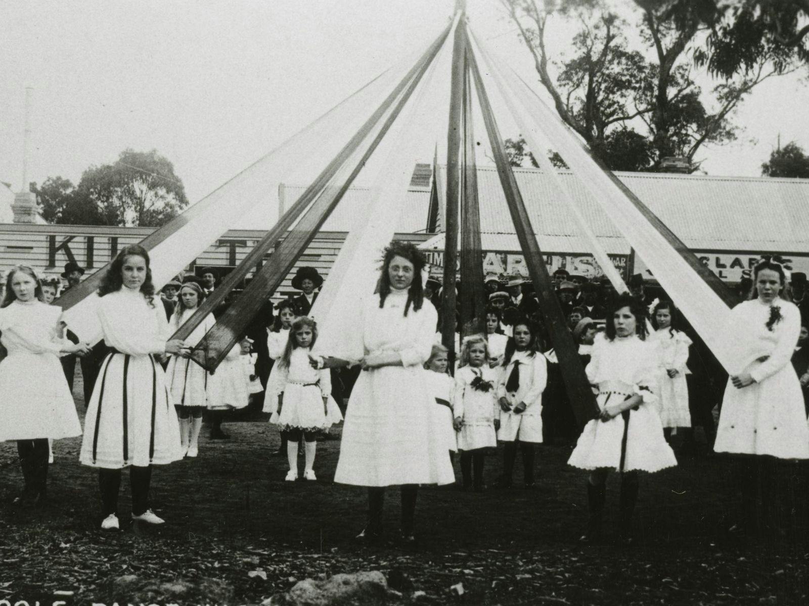 Maypole dancers posing for photo, taken 1911, black and white