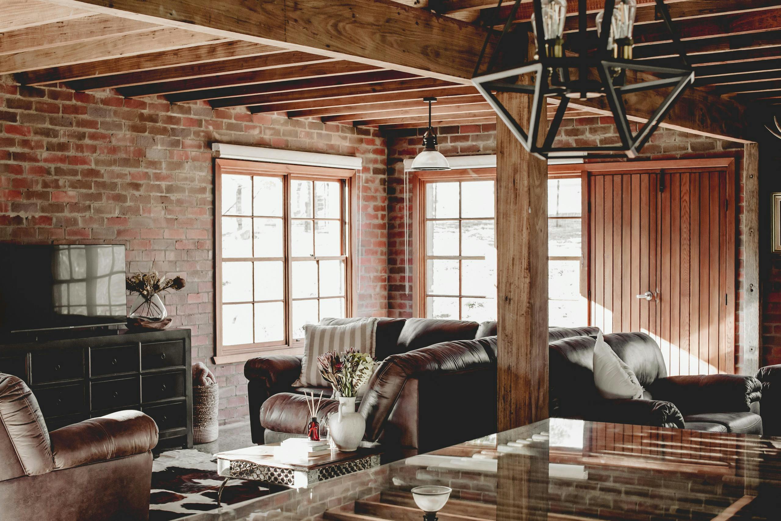 Interior living room with beautiful brick walls and rustic decor.