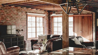Interior living room with beautiful brick walls and rustic decor.