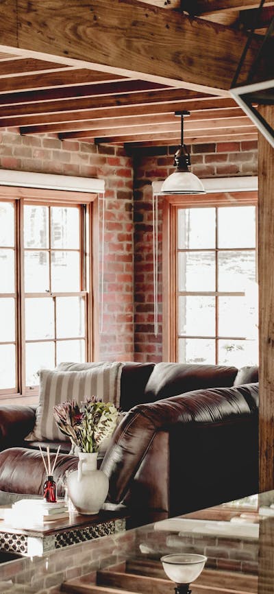Interior living room with beautiful brick walls and rustic decor.