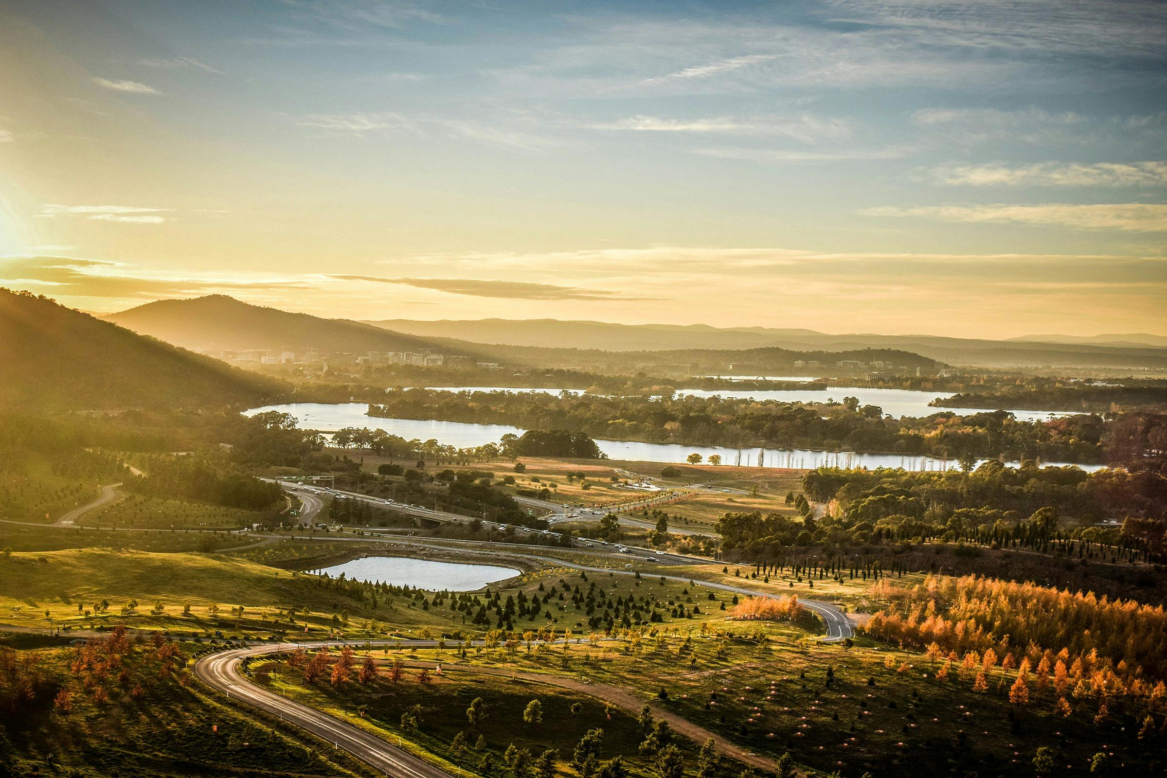 Looking over the National Arboretum and Lake Burley Griffin at sunset.