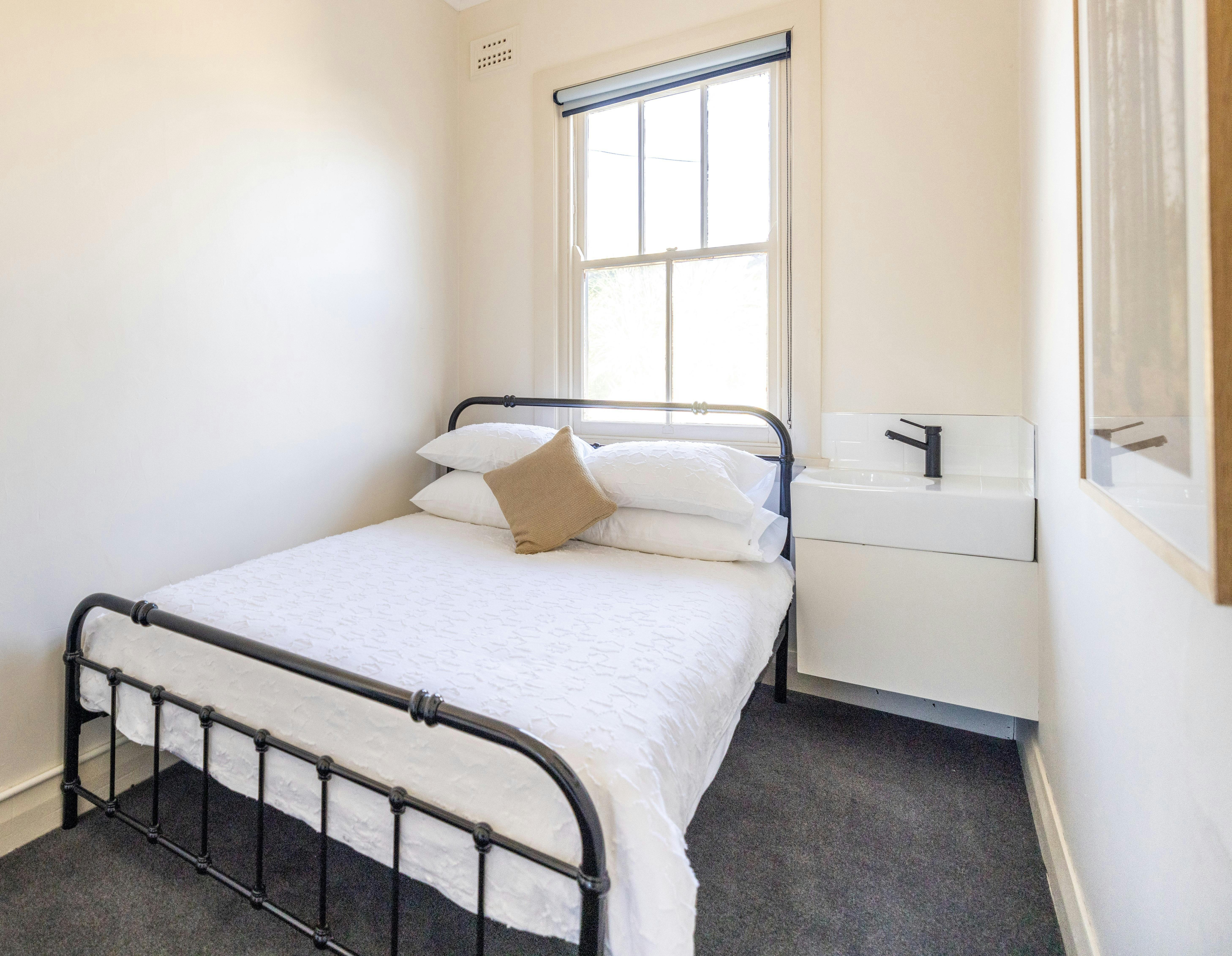 Double Room with bed and sink.