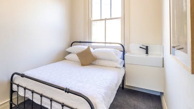 Double Room with bed and sink.